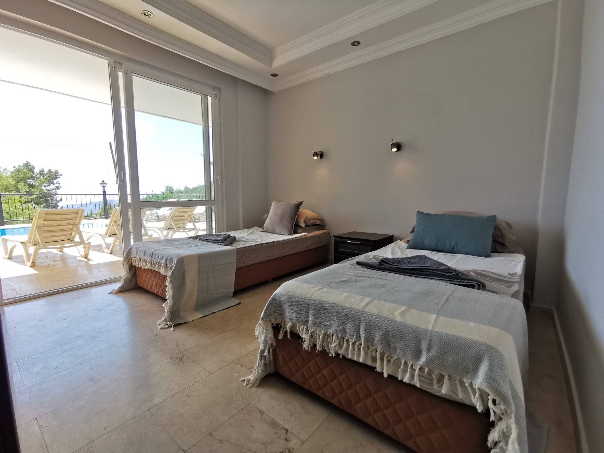 Bedroom 4 with patio doors leading to your pool