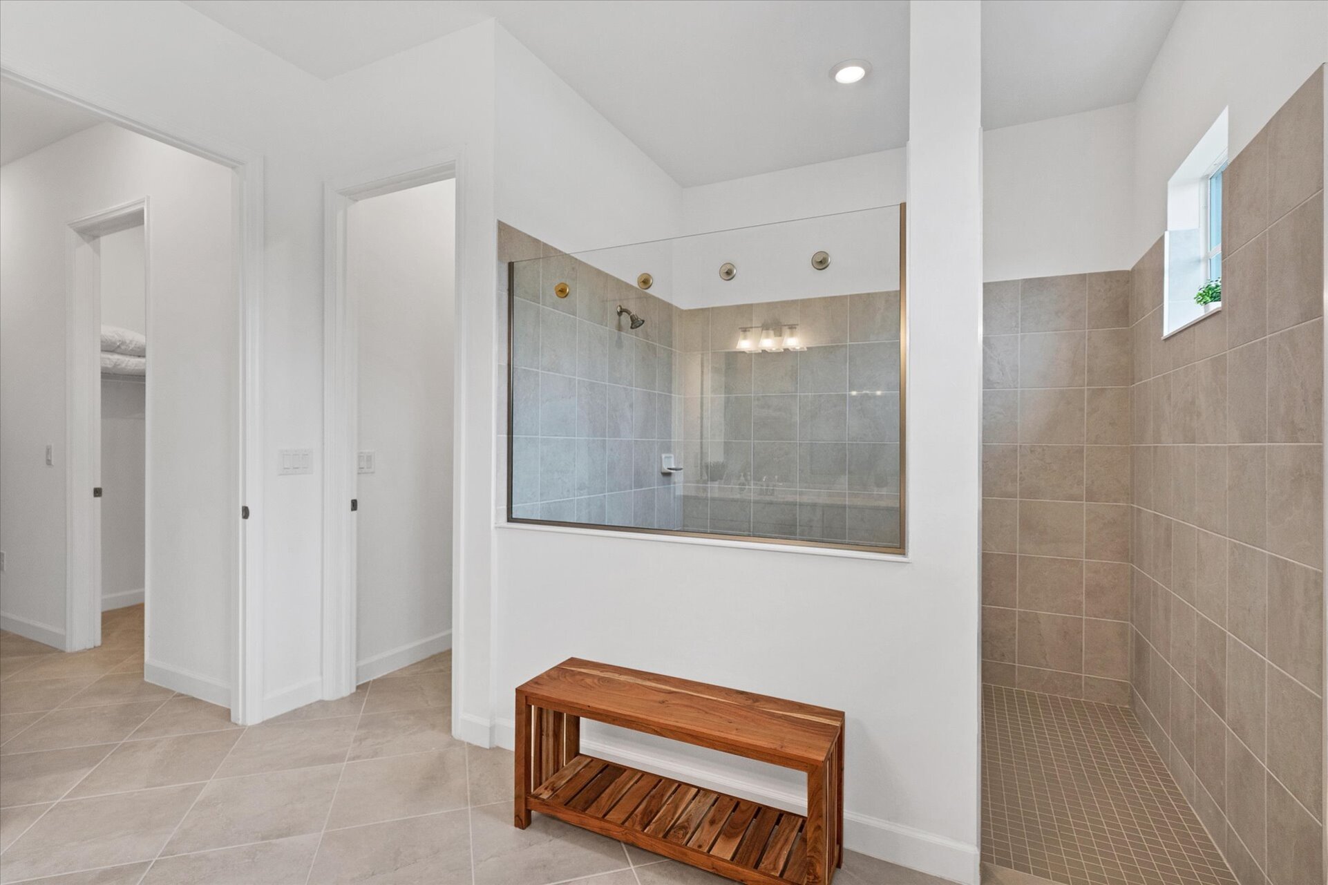 The primary bathroom has a huge walk-in shower