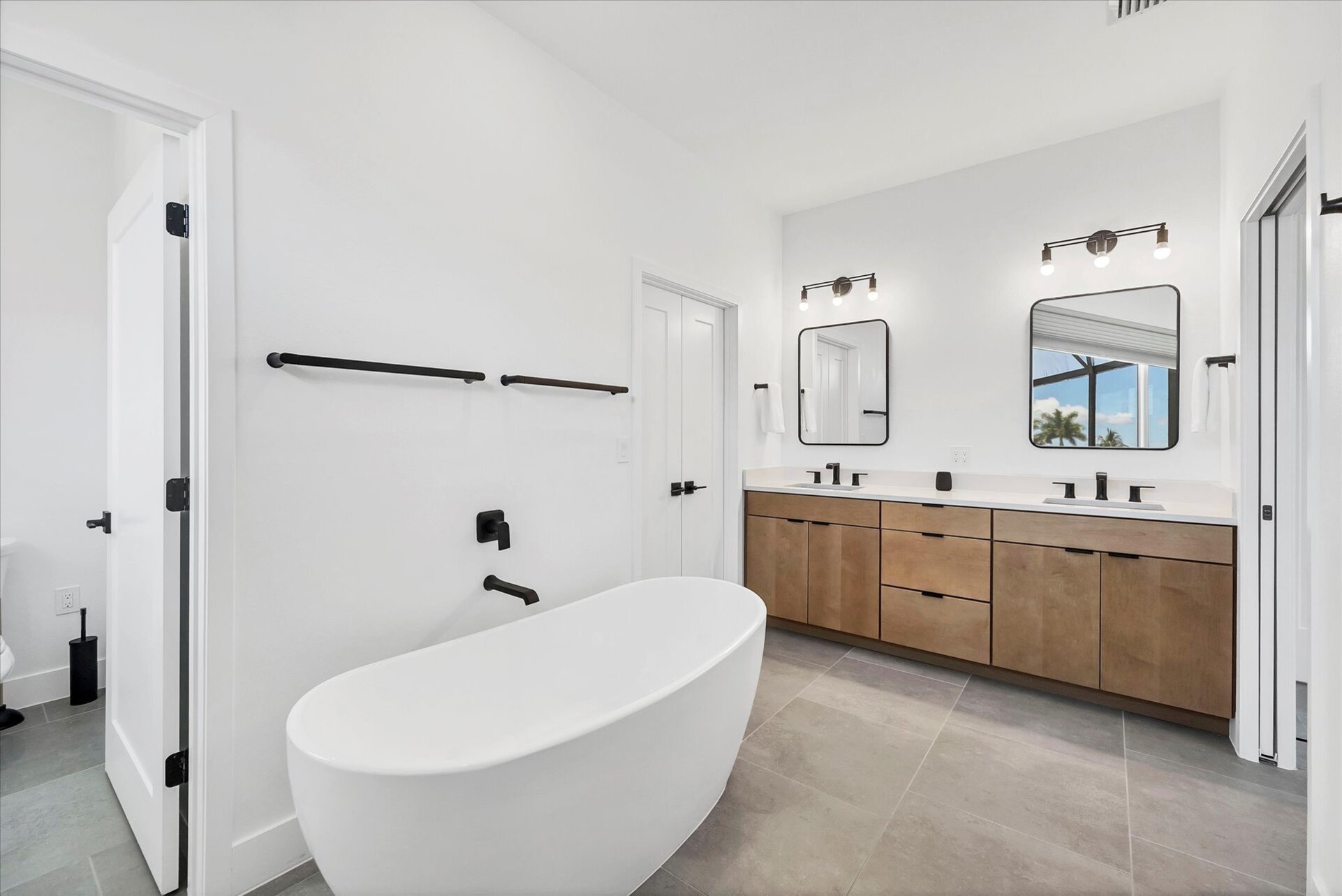 En suite with large walk-in shower, double vanities and soaking tub