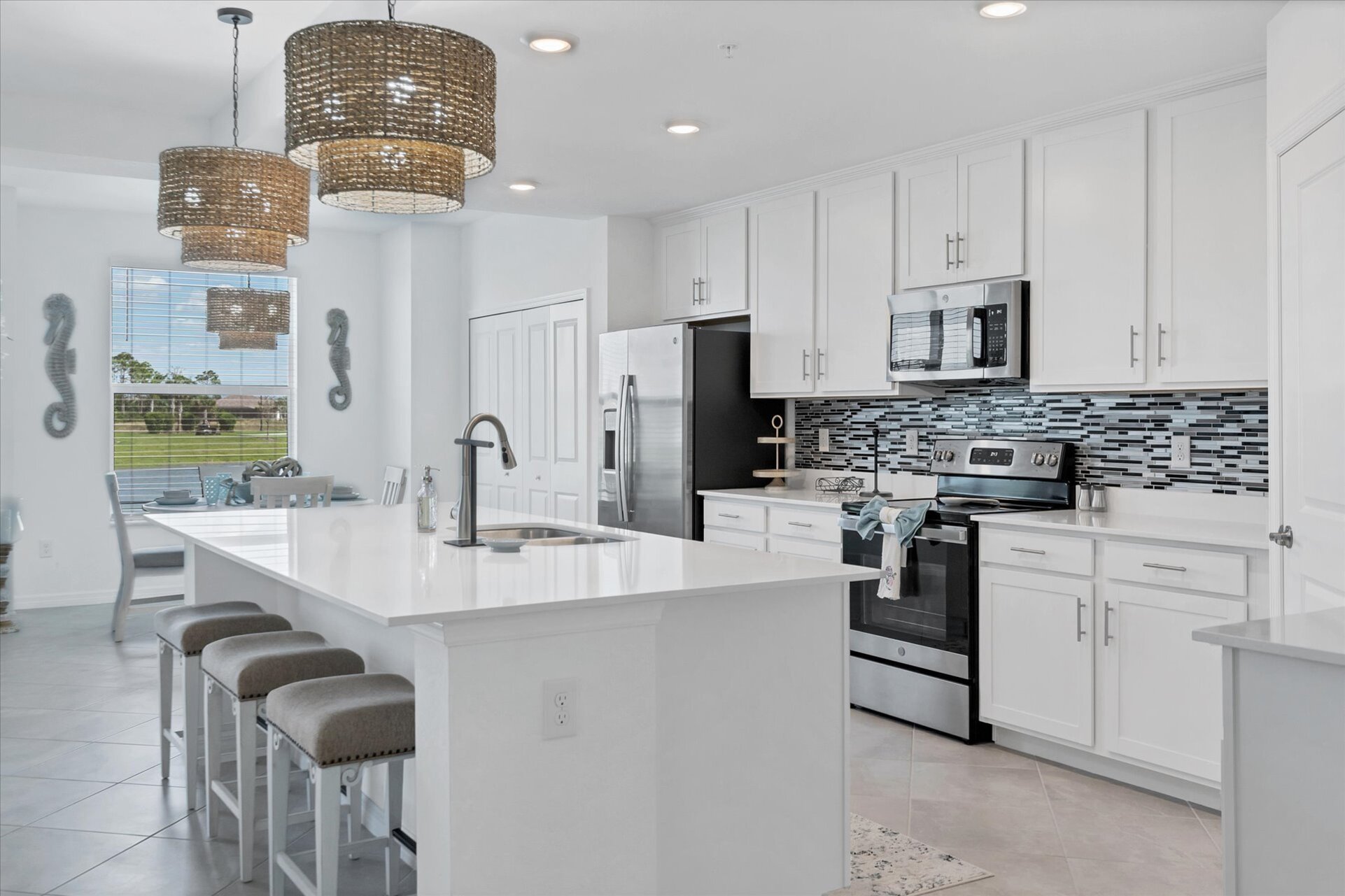 Gorgeous, bright, fully-equipped kitchen. Kitchen island seats 3