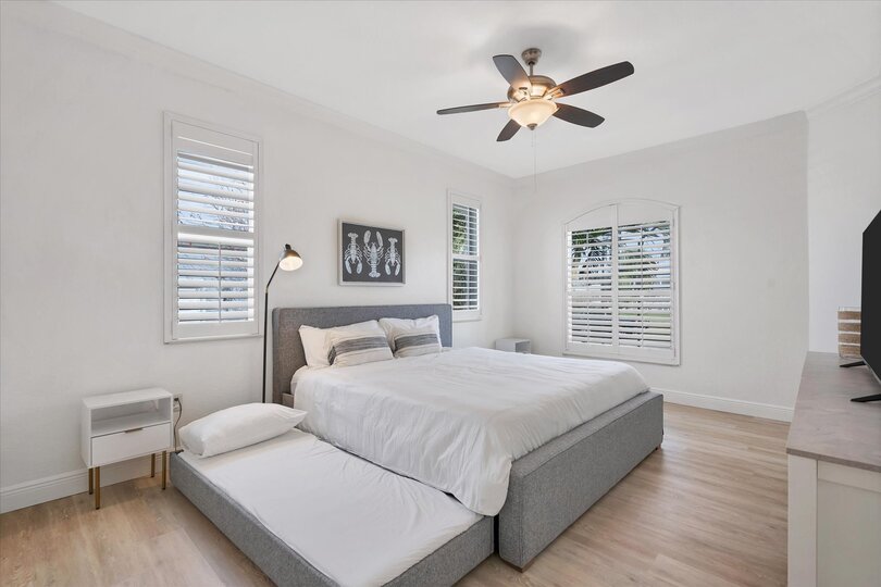 Guest bedroom has a king bed and two pullout twin trundle beds