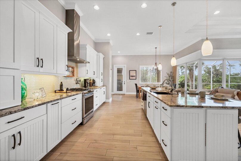 Gorgeous, bright, fully-equipped kitchen with stainless steel appliances, gas range, and plenty of storage & countertop space. Kitchen island seats 6
