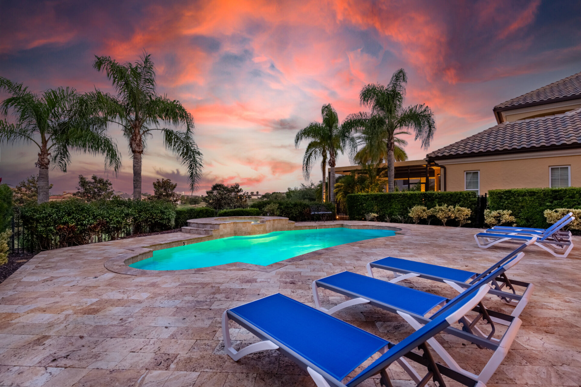 Grab a drink, head to the pool and watch the sun set over this amazing view