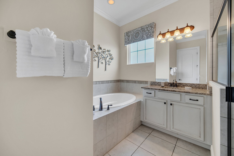 Take a soak in the large bathroom tub