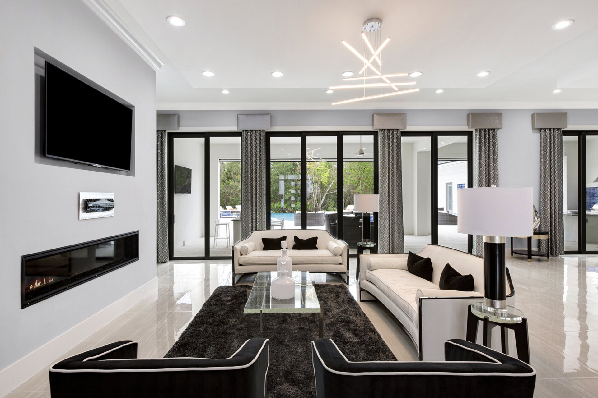 In this first living room area sit back and watch a movie (Fireplace not allowed for guest use)