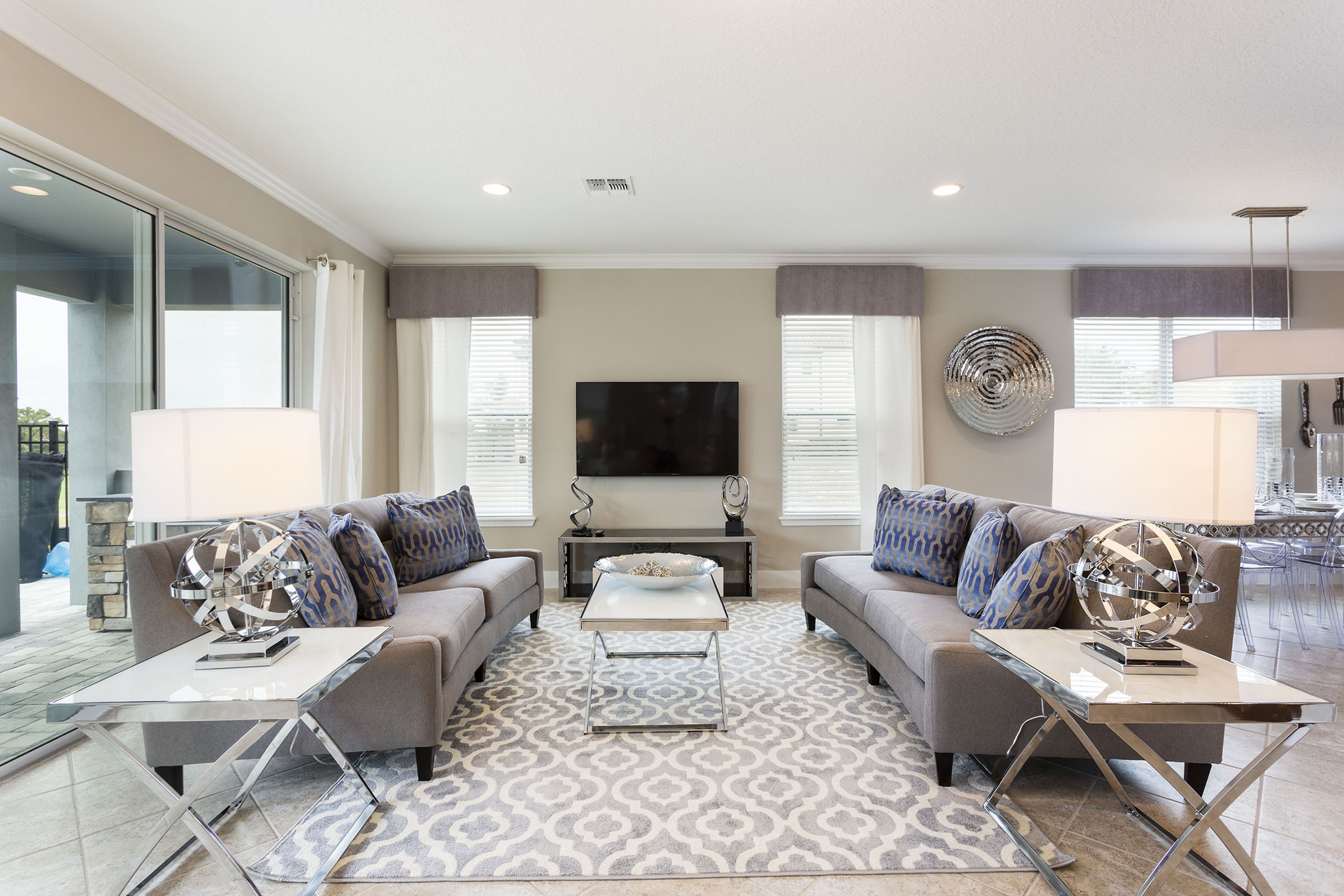 The living area features a 60-inch SMART TV