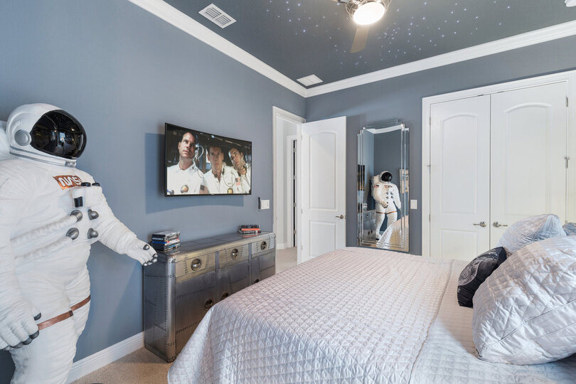 This bedroom has a 50 inch 4K curved SMART TV