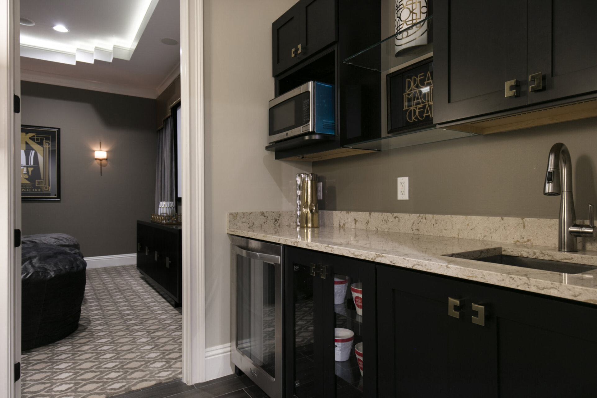 The theater room has a wet bar, wine cooler/fridge, and microwave