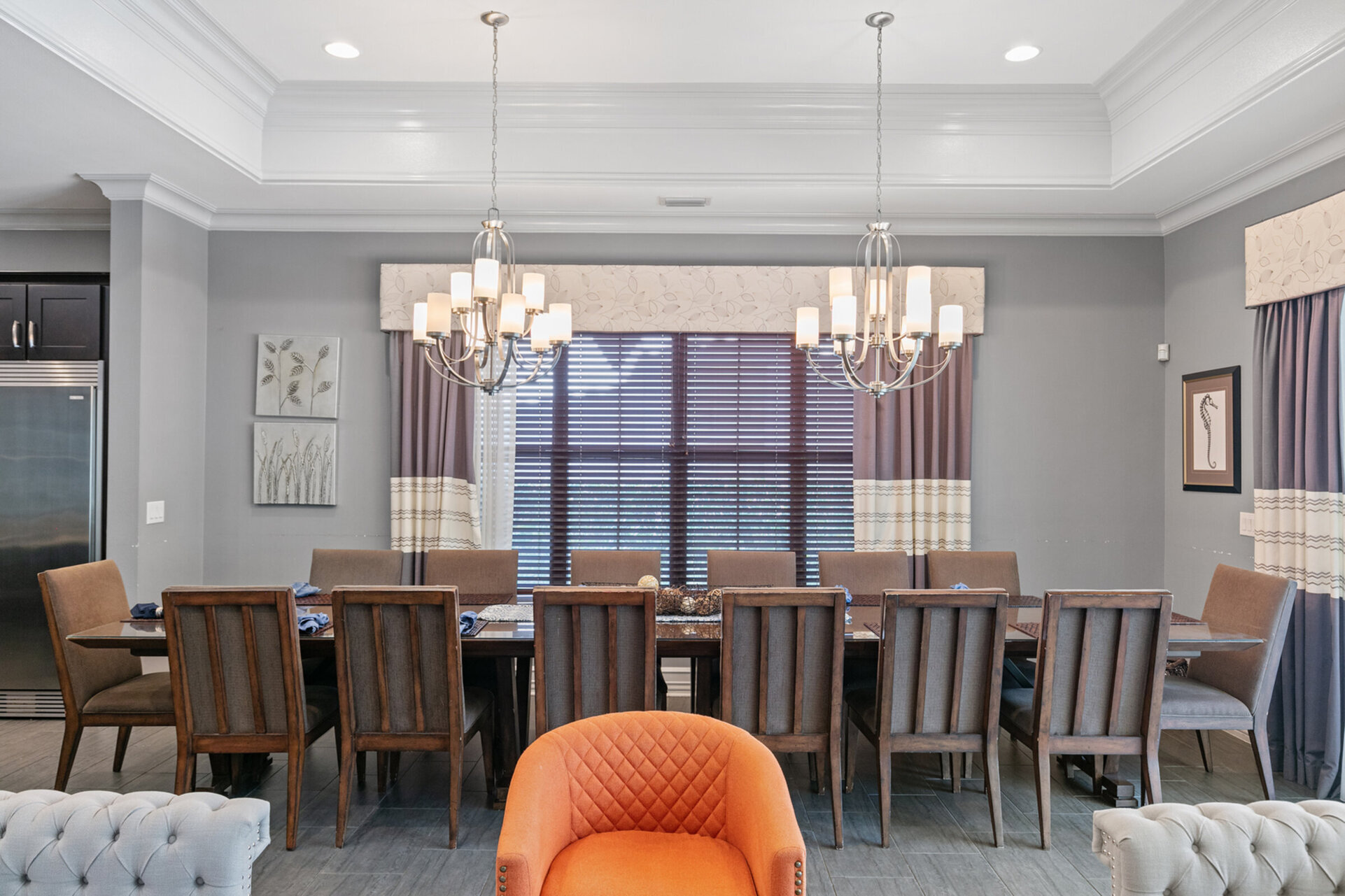 Enjoy family dinners in the dining table with seating for 14