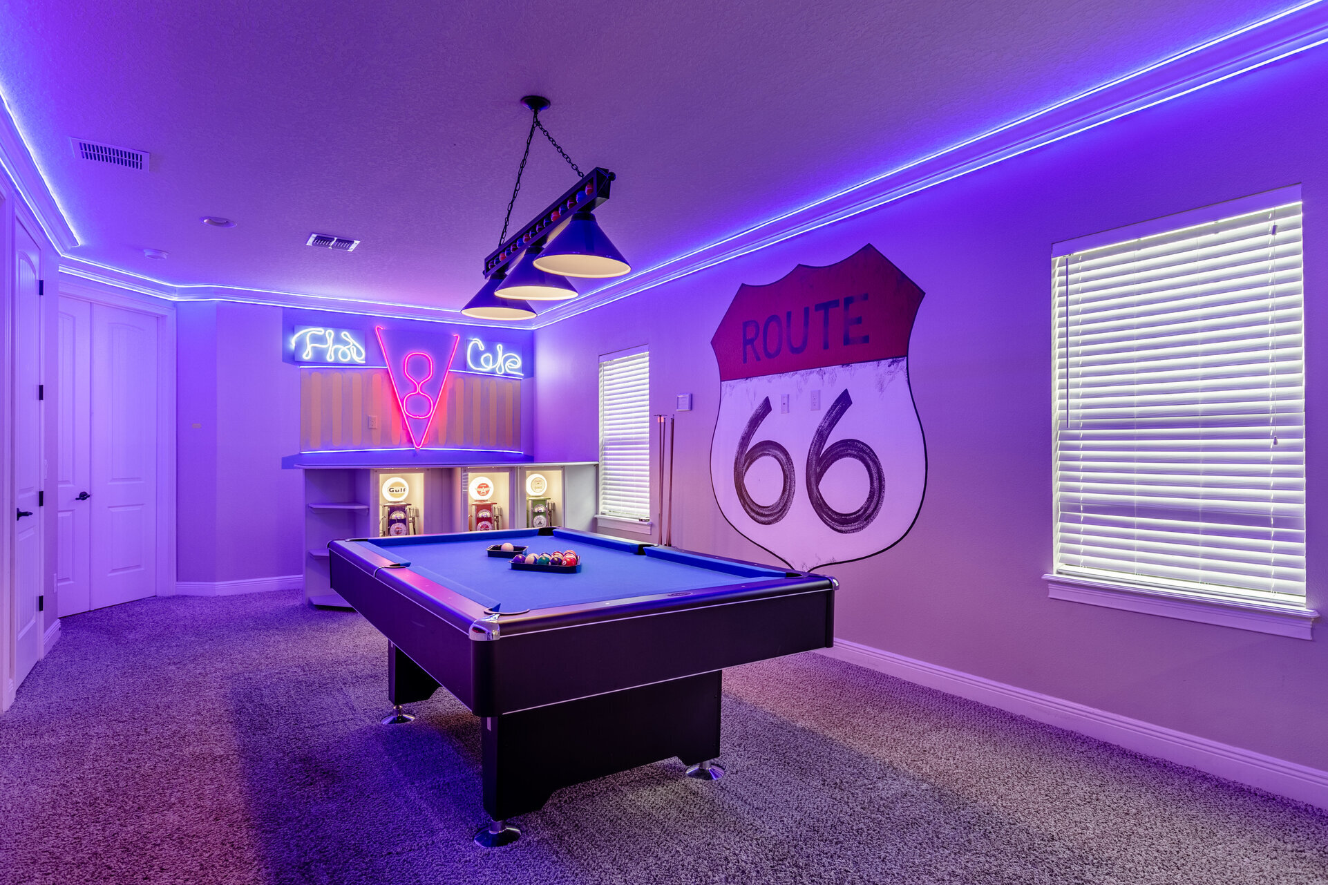 The room features a fun Cars theme complete with custom artwork and a pool table