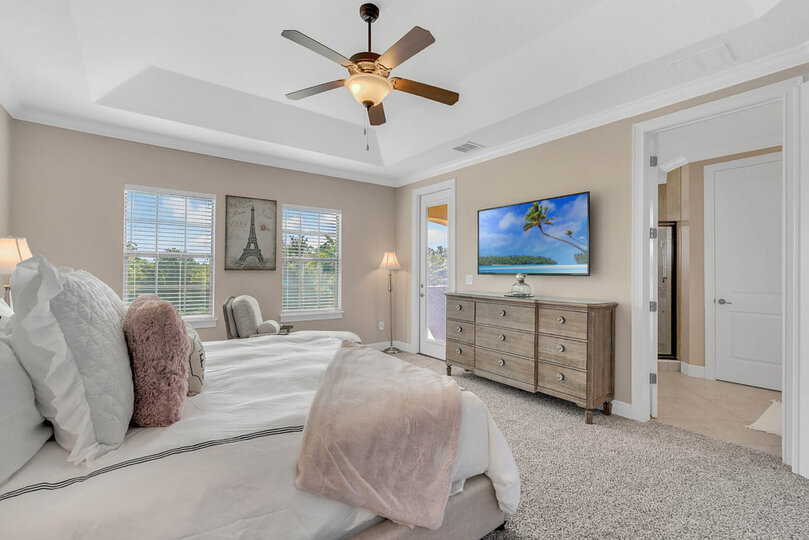 A beautifully designed Paris themed master bathroom upstairs with a King bed