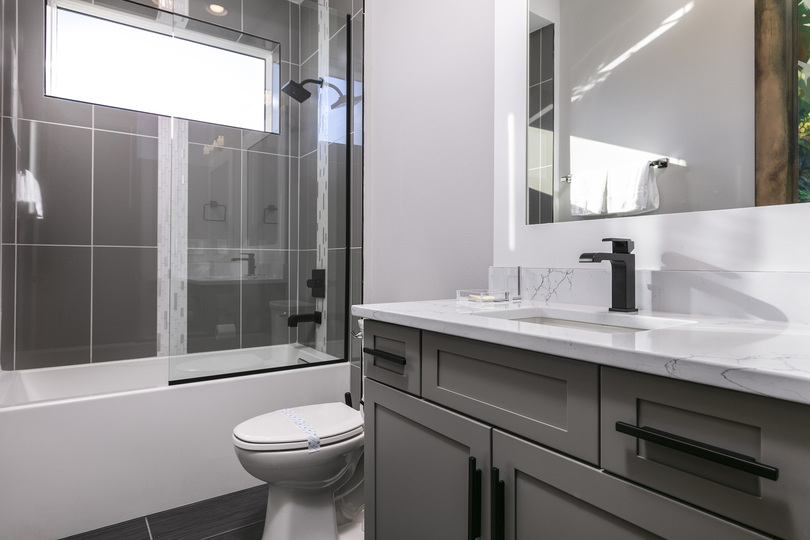 Kids can get ready in this ensuite bathroom with a shower/tub combo