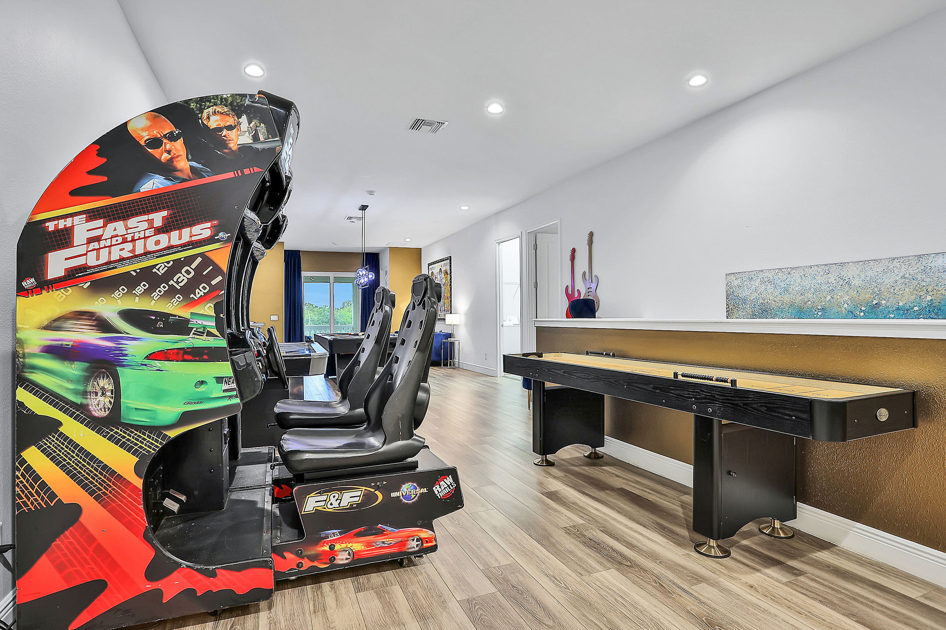 Test your aim at a game of shuffleboard or race with the Fast and the Furious dual racers