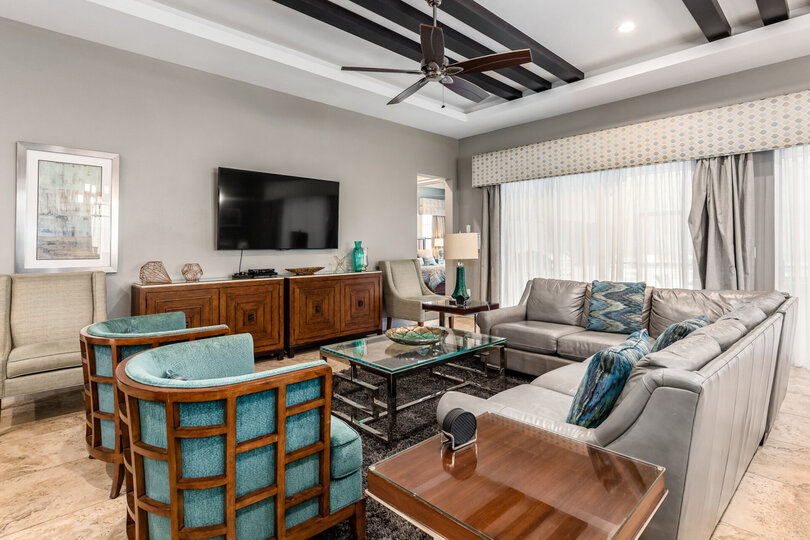 The living area leads out to the screened in pool area
