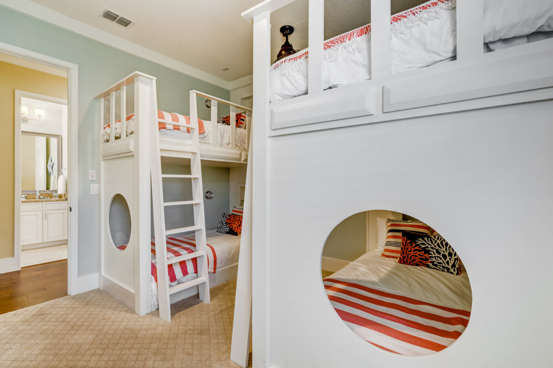 Fun kids bedroom with two sets of twin over twin bunk beds