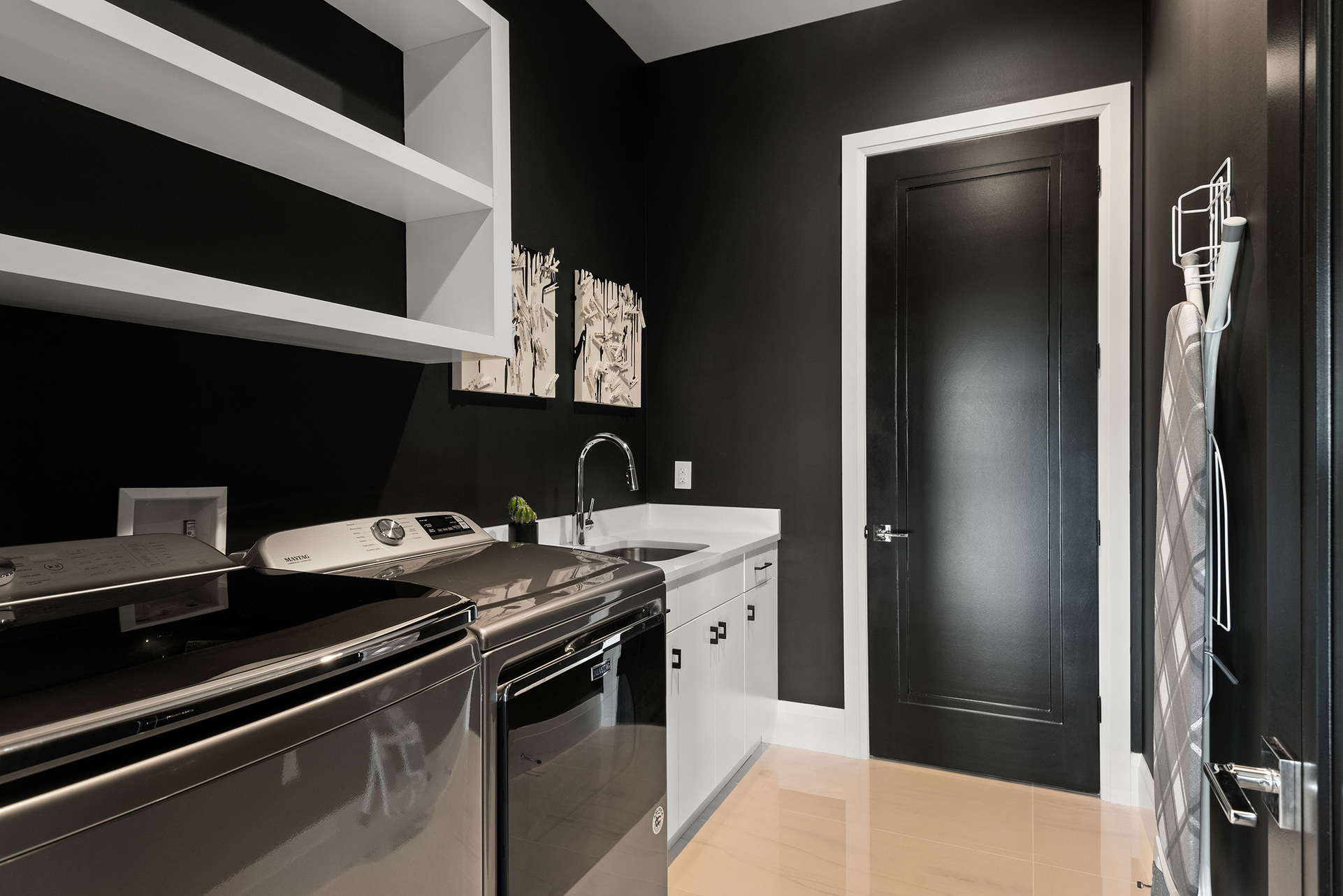 An iron and sink can also be found in the laundry room