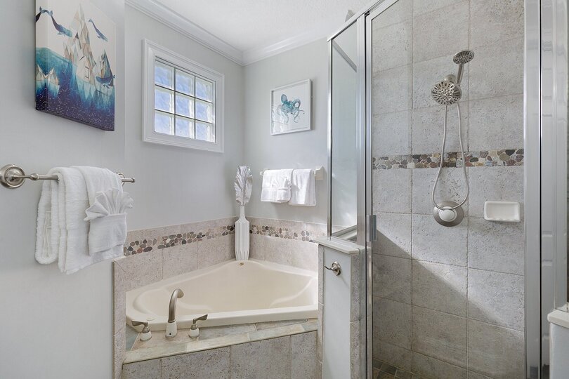 The ensuite bathroom has a beautiful garden tub and walk in shower