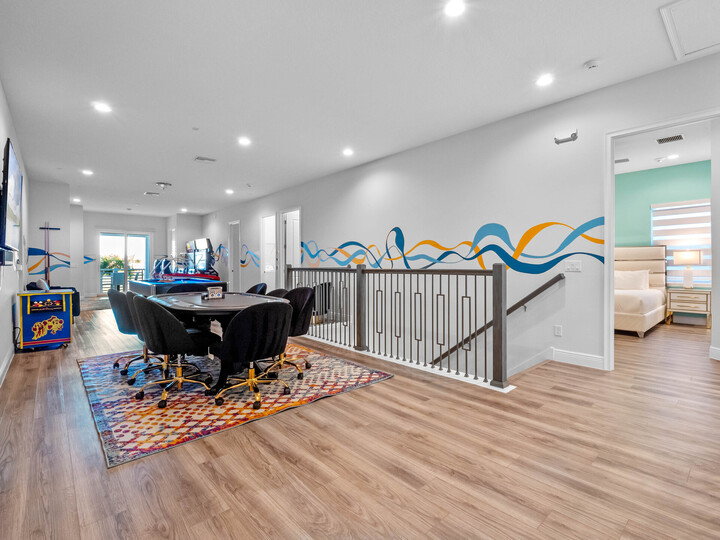 Step into the ultimate entertainment zone! This lounge area is a haven for fun-seekers, featuring a pool and poker table alongside a thrilling NASCAR car racing arcade. Let the games begin!