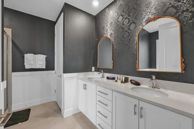 Enjoy the convenience of an en-suite bathroom featuring a walk-in shower for a refreshing start to your day
