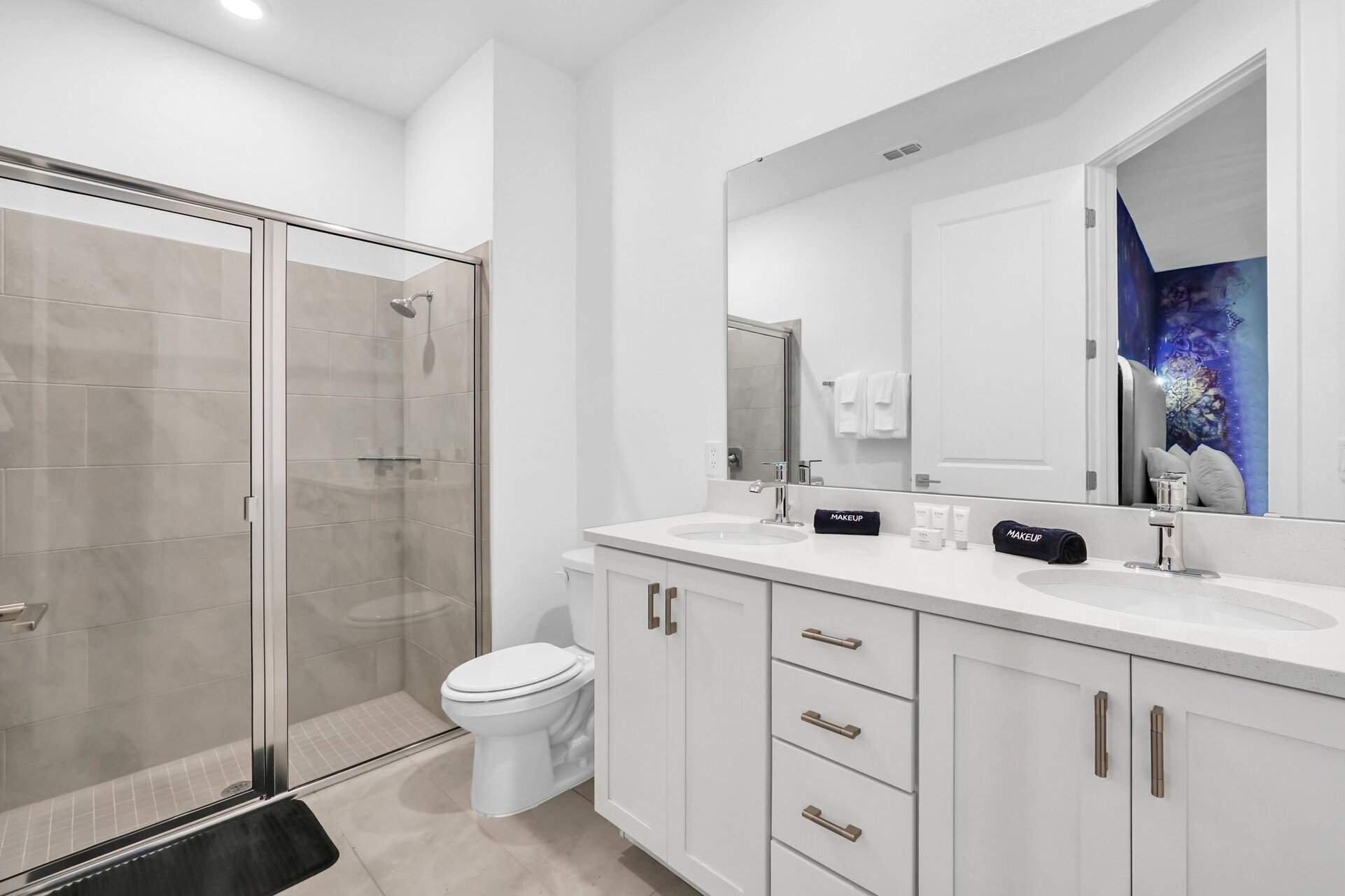 Enjoy the convenience of an en-suite bathroom featuring a walk-in shower for a refreshing start to your day