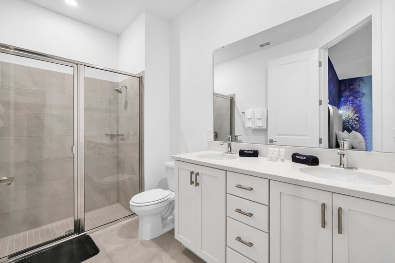 Enjoy the convenience of an en-suite bathroom featuring a walk-in shower for a refreshing start to your day