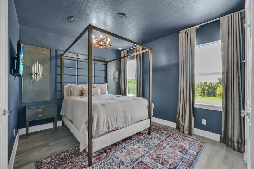 Sink into comfort with this sophisticated bedroom, offering a serene and inviting space for unwinding and relaxation