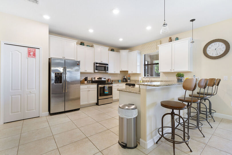 Cook gourmet meals in the the fully equipped kitchen with stainless steel appliances