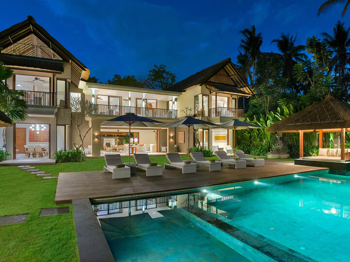 The villa lit up at night