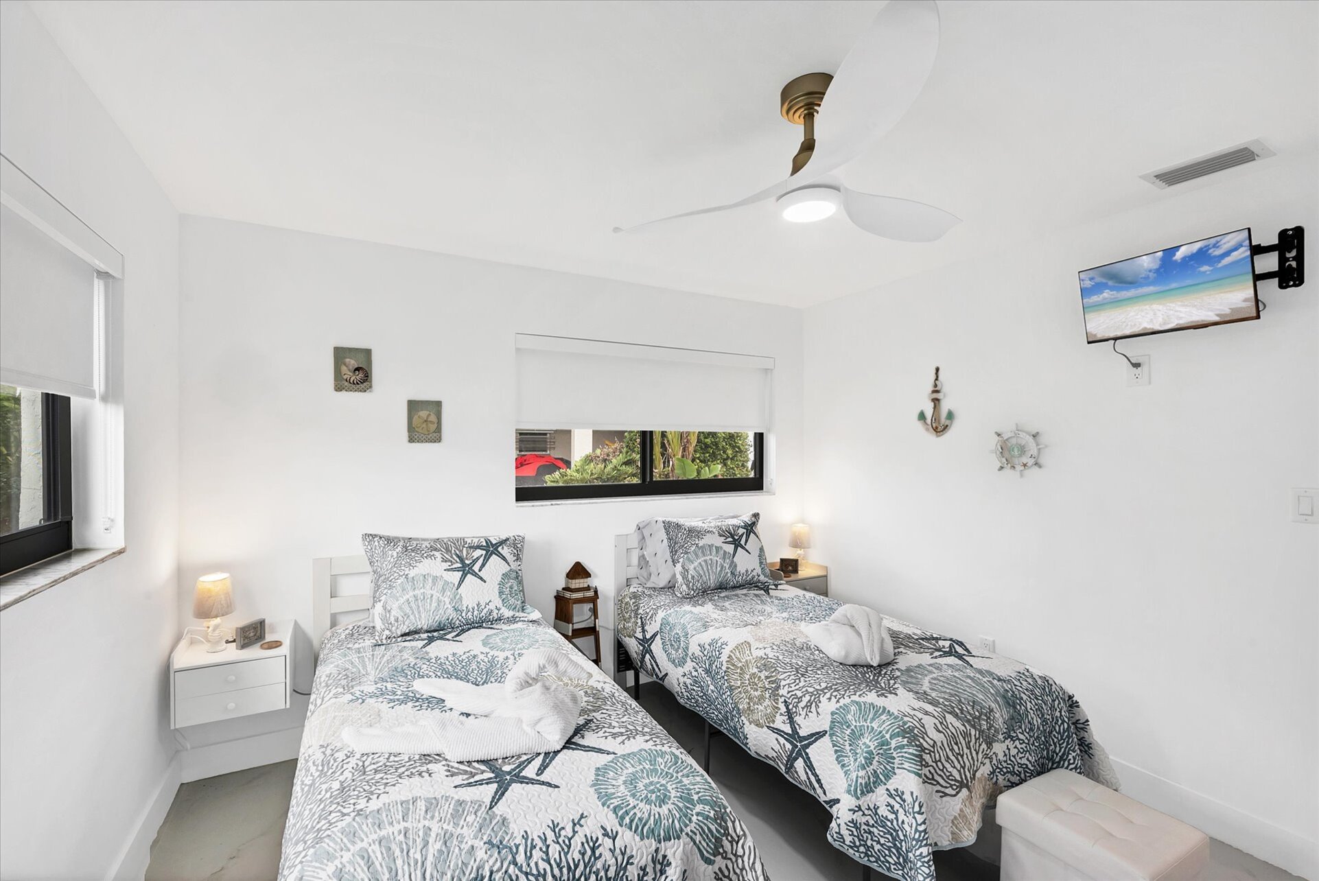 Twins bedroom featuring two twin beds and 24-inch Smart TV