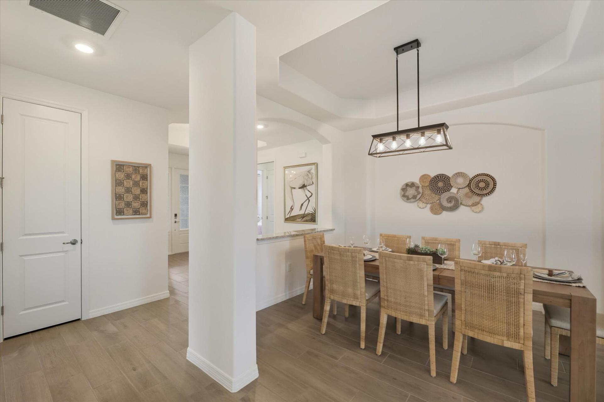 Dining area. Dining table seats 8with additional seating for 4 at the kitchen island