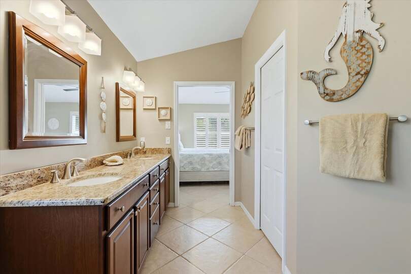 Attached bathroom with large walk-in shower and double vanities