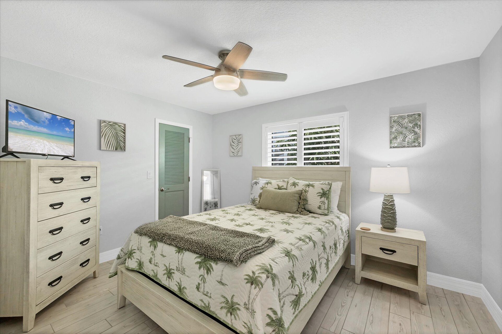 Guest bedroom with queen bed and 32" Smart TV