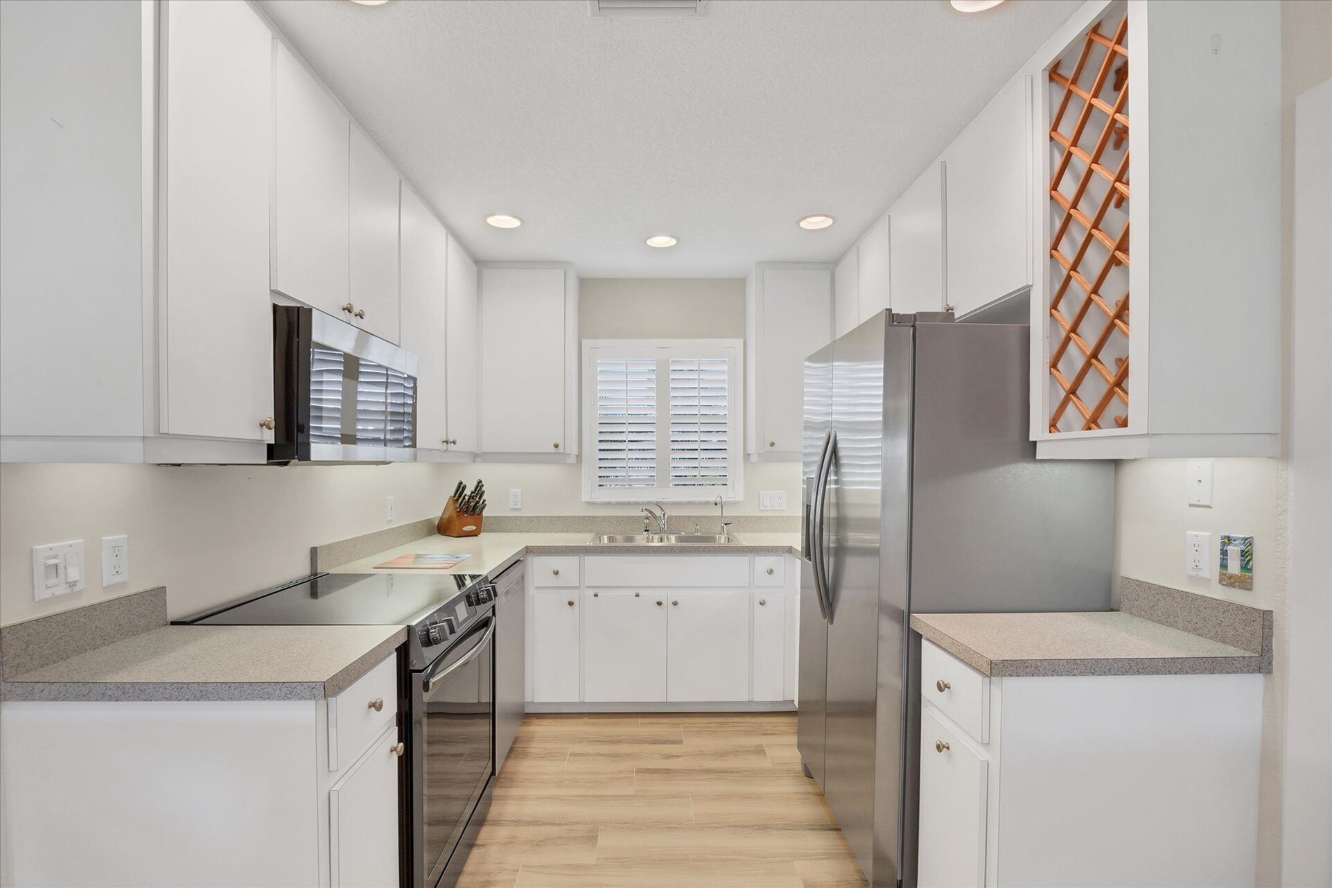 Fully-equipped kitchen overlooking the dining room and living room. Dining table seats 4 with an additional 4 at the kitchen island
