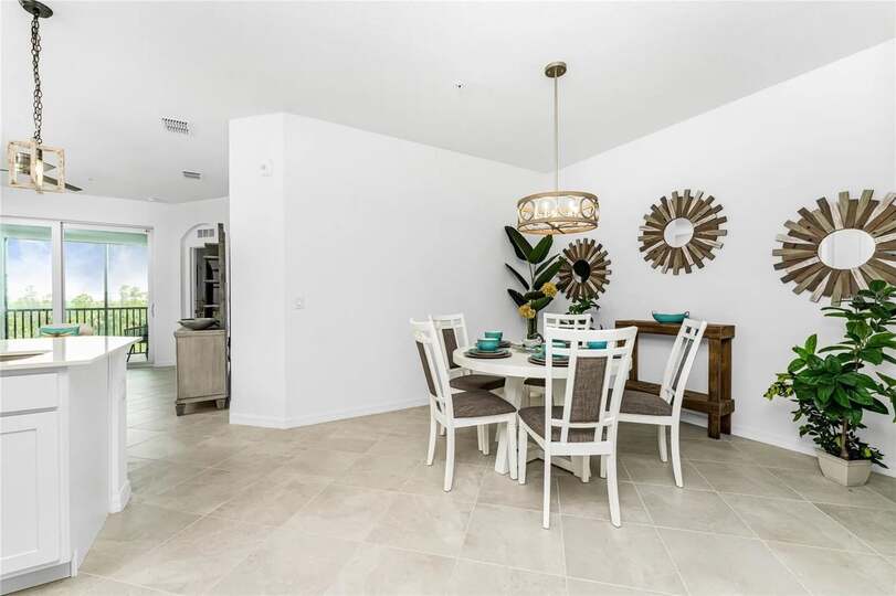 Dining table seats 5 with additional seating for 3 at kitchen island