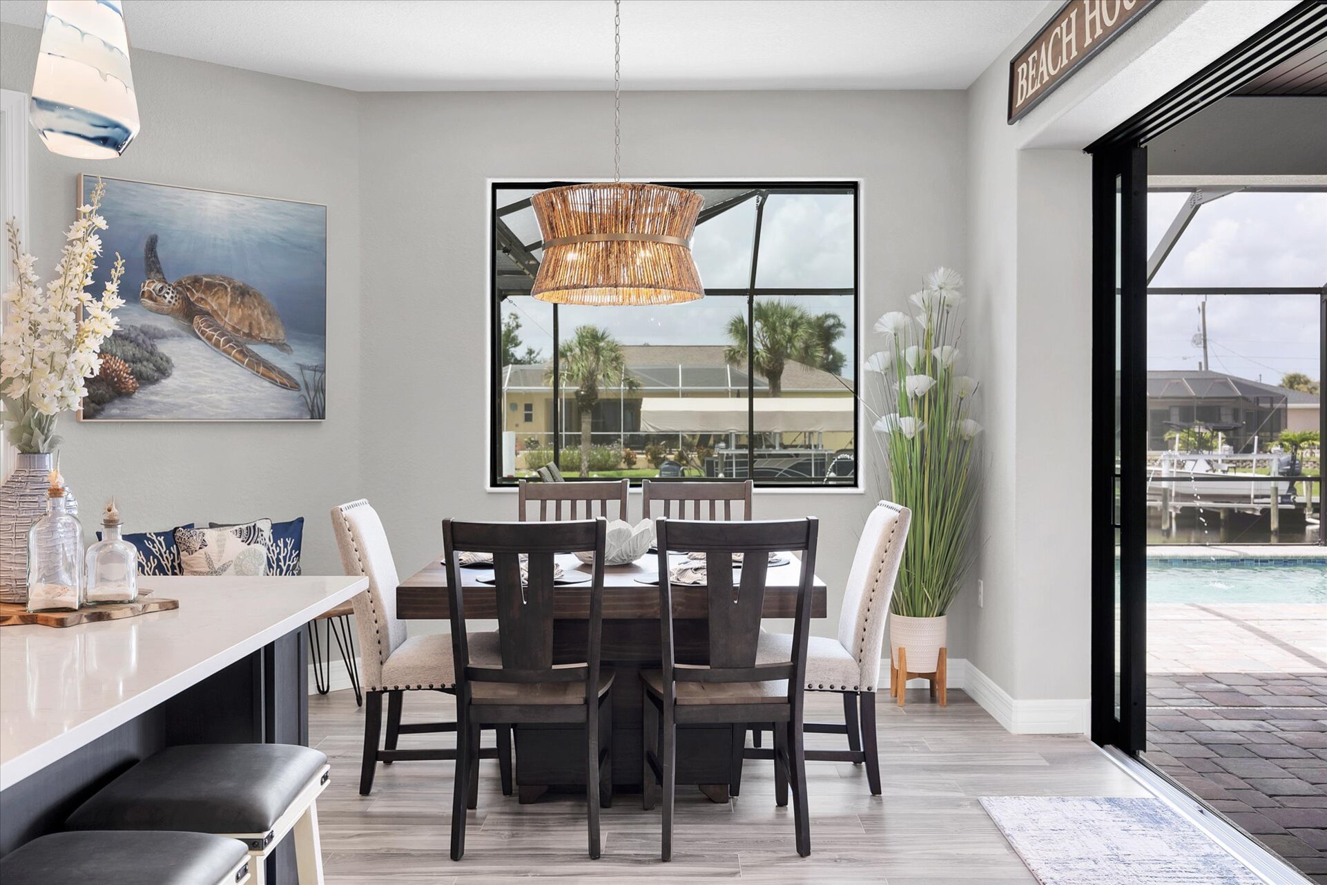 Dining seats 8 with additional seating for 4 at the kitchen island