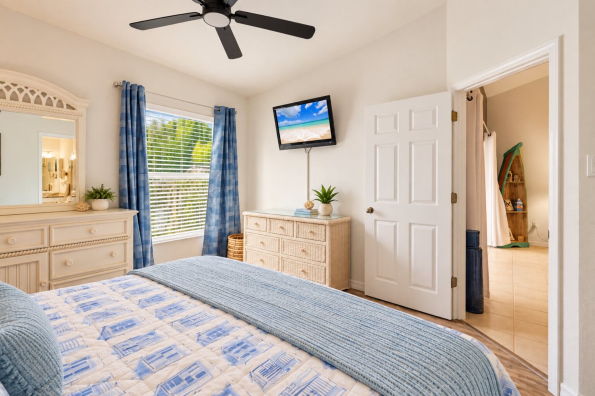 Primary bedroom with king bed, attached bathroom and 37-inch TV