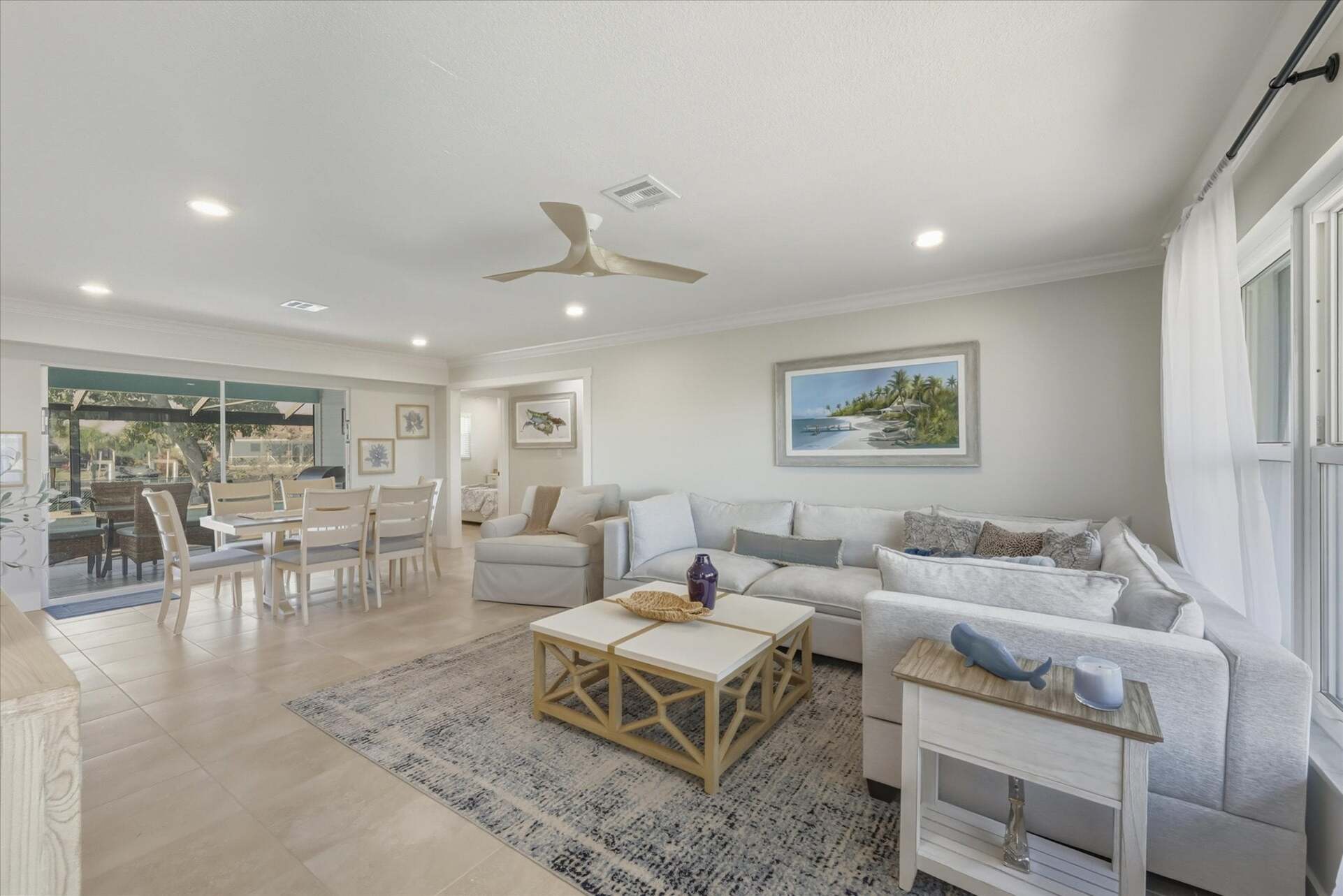 Open living space features lots of comfy seating and 65-inch Smart TV