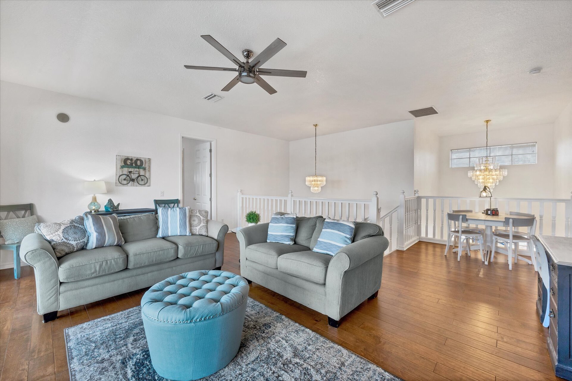 Loft with balcony access. Loft features comfy sofas, desk, queen sleeper sofa, 42" Smart TV and poker table