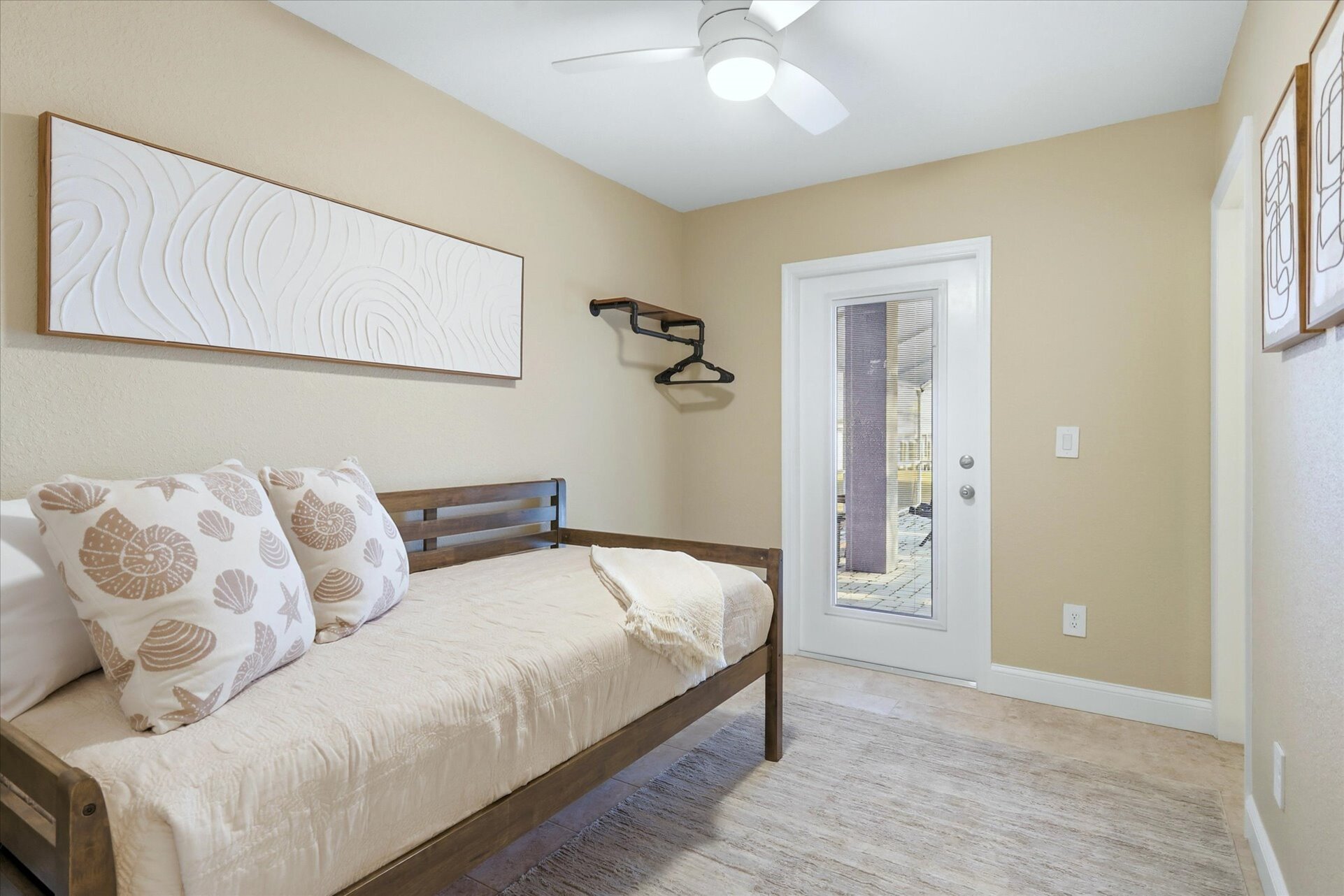 Bedroom 4 - Downstairs with twin daybed with twin trundle bed, lanai access and attached bathroom