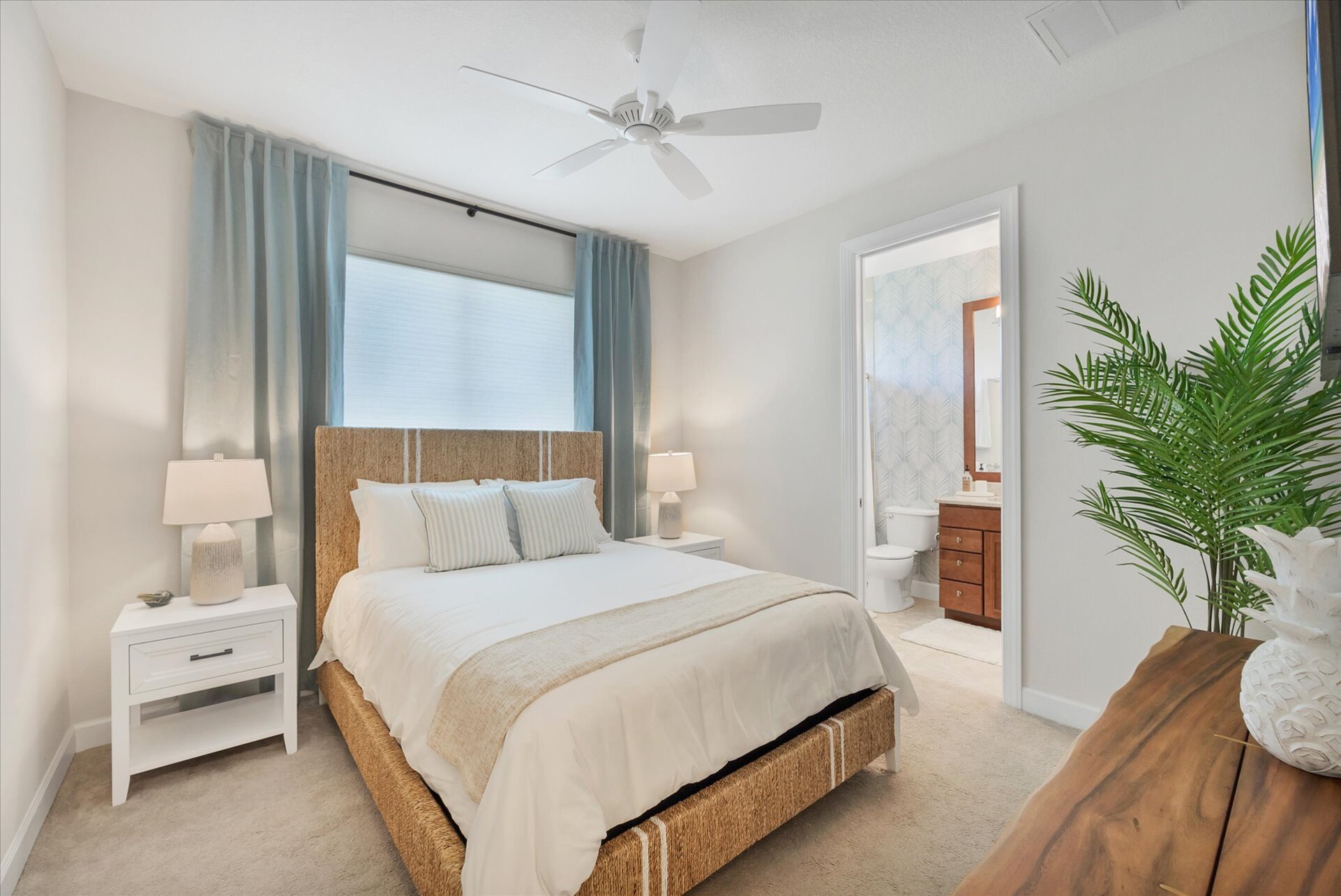 Guest bedroom 3 with queen bed, attached bathroom, and 43-inch Smart TV