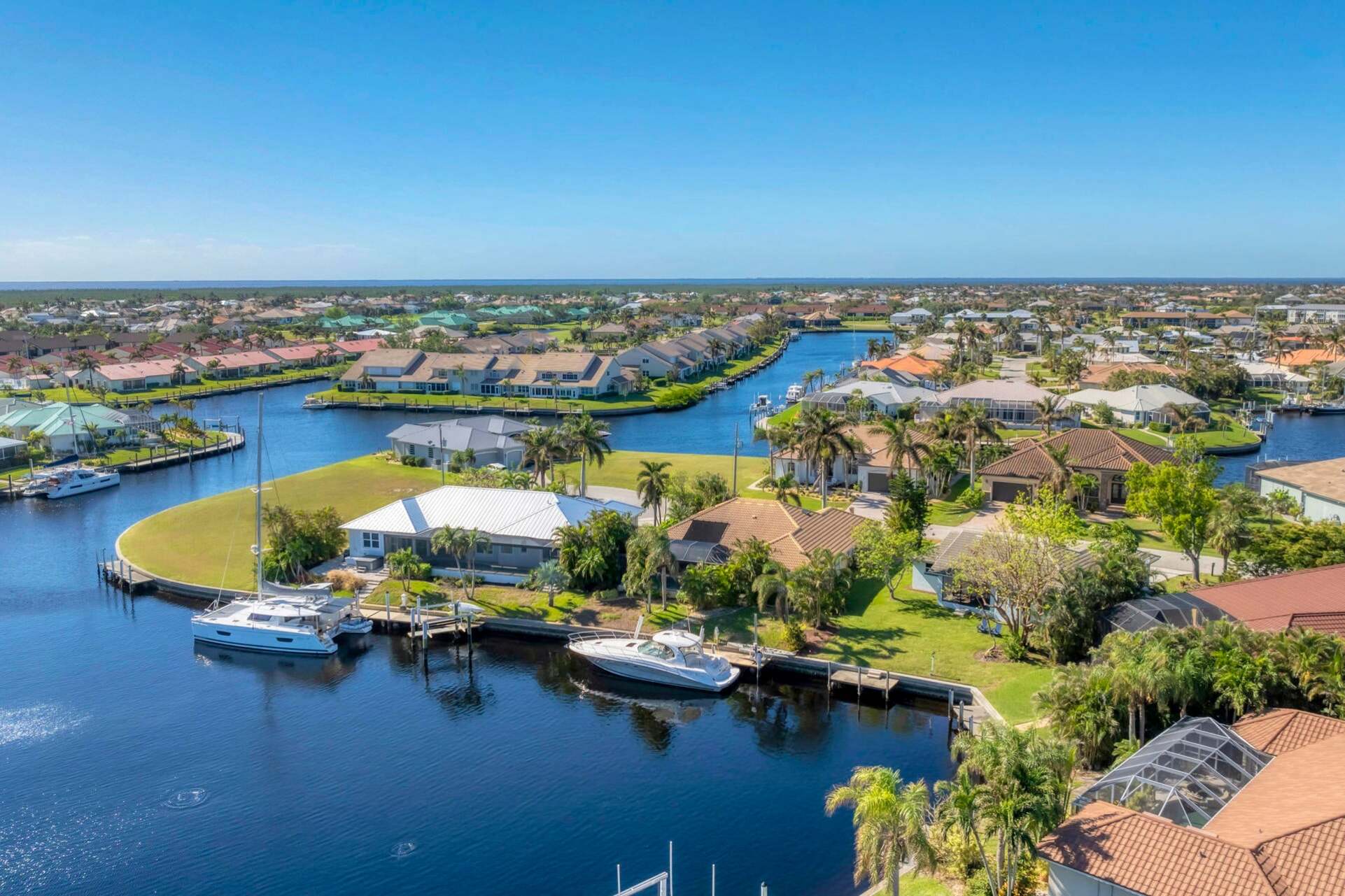 This meticulously maintained and fully remodeled home is situated on a peaceful cul-de-sac, offering the ultimate Florida lifestyle with sailboat access to Charlotte Harbor and the Gulf via Buckley Pass. (Boat lift not available)