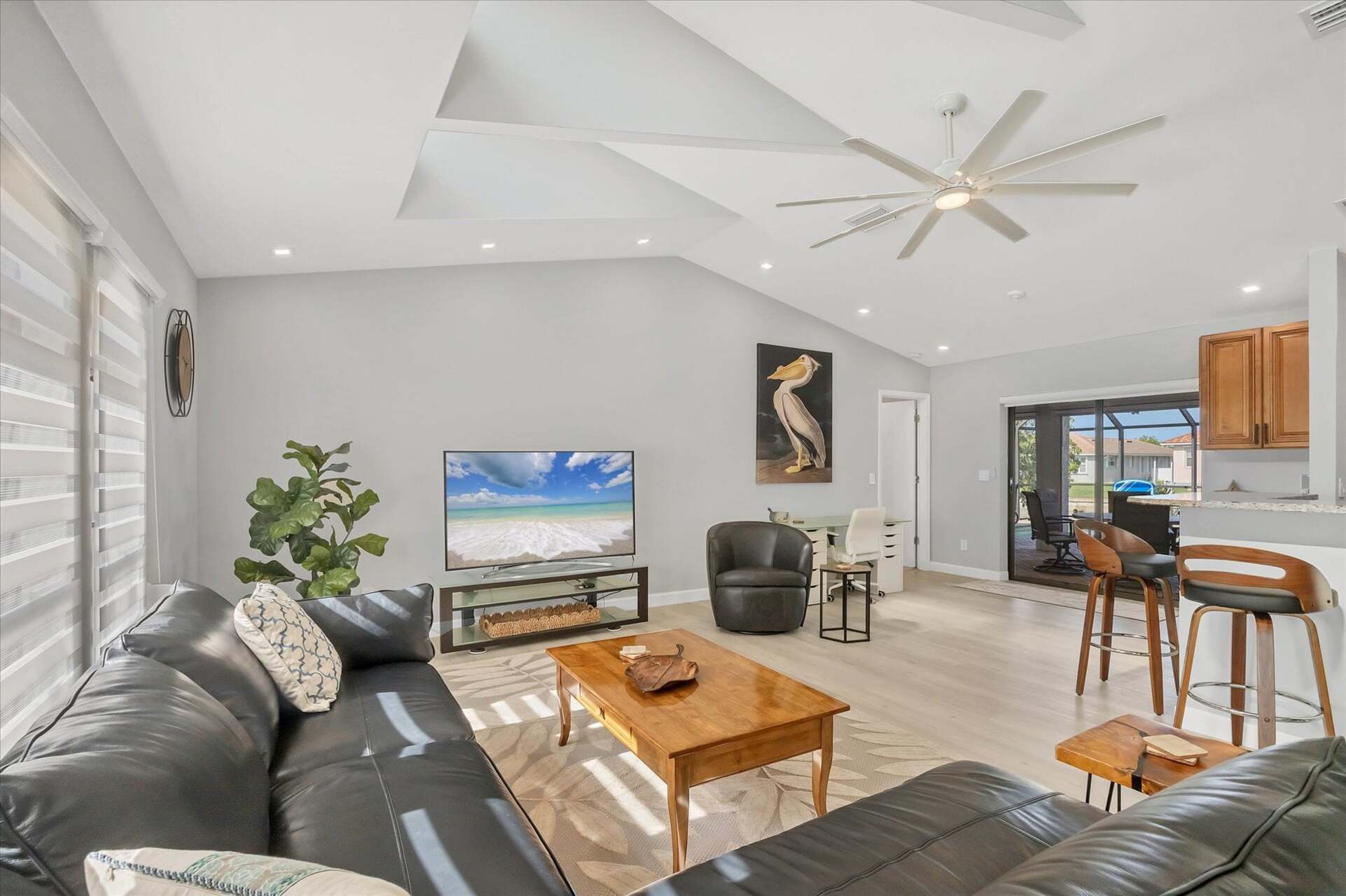 Large, Open, and Bright Living Area with 65" Smart TV